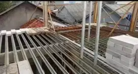 Tukang bangunan propesional
