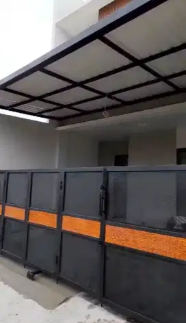 Pintu lipat perforated motif kayu