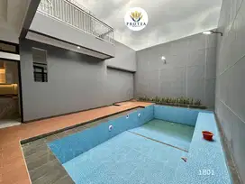Rumah Minimalis Modern dengan Kolam Renang di di Jalan Utama