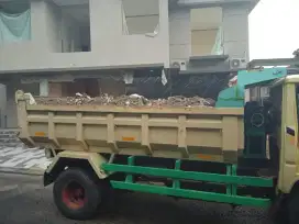 Buang puing sampah proyek