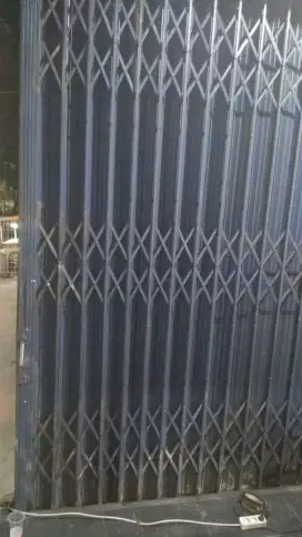 Tukang reparasi service rolling door folding gate murah