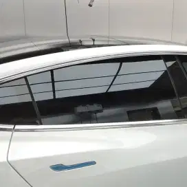 Dealer resmi kaca film mobil di jamin rapi