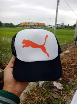Topi trucker jaring logo citah lompat puma