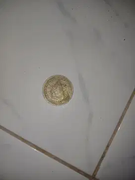 uang logam 100 rupiah rumah gadang