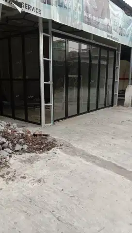 Pintu lipat aluminium kaca
