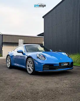 Brand New 2025 Porsche 911 (992.2) Carrera – Lugano Blue on Black