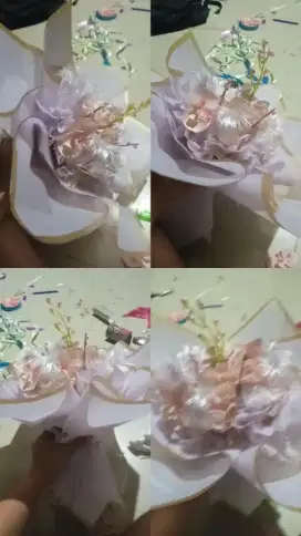 Buket bunga yg terbuat dari kain satin,dilengkapi dengan pita yg lucu