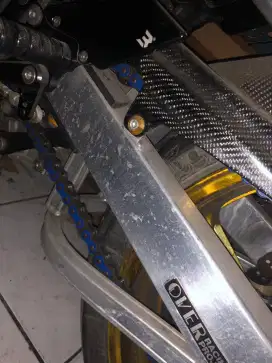 Over racing arm