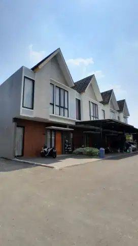 RUMAH DALAM CLUSTER MEWAH DENGAN KONSEP TROPICAL MODERN ALA EROPA .