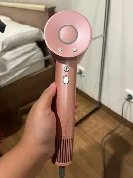 Preloved Hair dryer ona high speed - coral pink