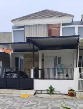 Rumah minimalis modern 1 lt New Gres di Griya Kebraon Surabaya murah