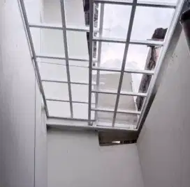 Kanopi sliding rangka hollow galvanis atap solartuff flat