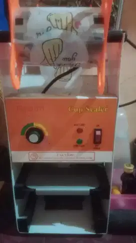Di jual mesin press minuman dan cointainer batu es nego