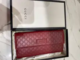 Gucci Women’s GG Microguccissima Continental Flap Wallet in a red