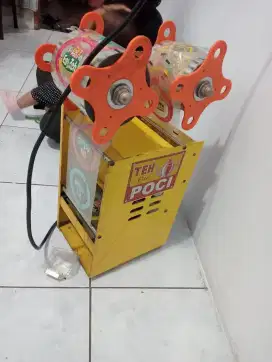 Mesin pres gelas plastik logo Teh Poci