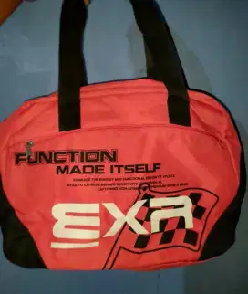 tas travel branded merah