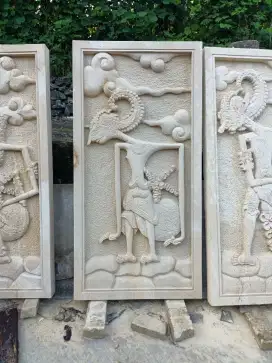 Ukiran batu alam motif wayang