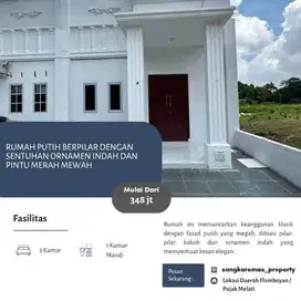 Rumah Putih Berpilar dengan Sentuhan Ornamen Indah dan Pintu Merah Mew