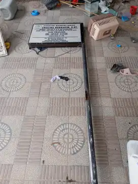 Plang neon box bekas bidan praktik