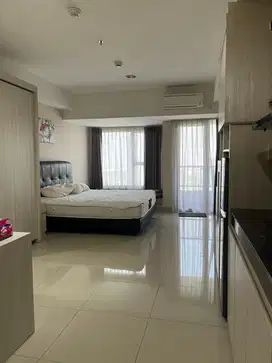 Sewa Apartemen Studio 42 m², Orange County Lippo Cikarang, 65 Jt/Thn!
