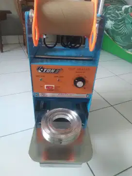 Alat penyegel gelas plastik