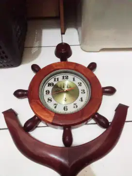 Jam dinding motif stir kapal