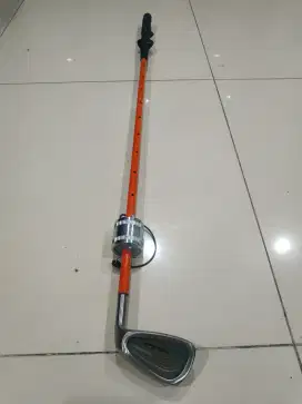 Golf club swing trainer