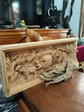 Ukiran relief kayu jati