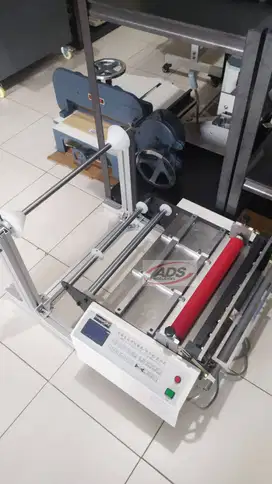MESIN PEMOTONG BAHAN PLASTIK SISTEM OTOMATIS ROLL TO ROLL