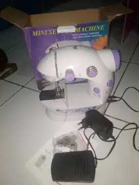 Mesin jahit mini portabel