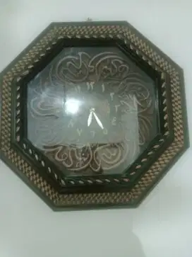 Jam dinding Kaligrafi
