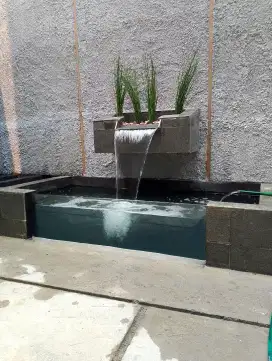 Kolam kaca ikan koi dan taman