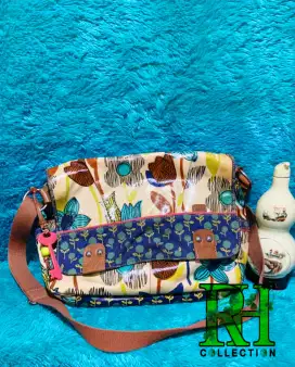 TAS SELEMPANG F*SSIL KEYPER COATED CANVAS FLORAL MULTI COLOR