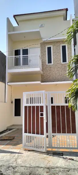 Rumah cantik 2 lantai DP minim Wiguna