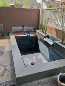 Pembuatan kolam ikan koi minimalis dan taman batu alam