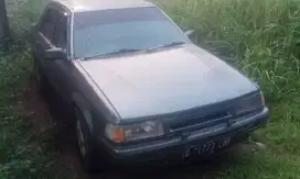 Ford laser 1300cc th 98 ac dingin irit bensin
