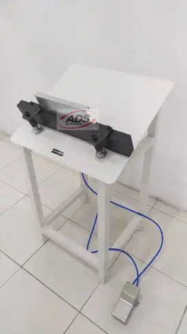 MESIN TATA ALBUM PNEUMATIC UNTUK PEMBUATAN PHOTOBOOK