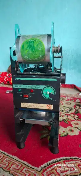 Mesin cup sealer milea