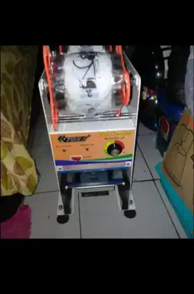 Mesin press merek Q'TON &termos es jumbo ukuran 30 ML merek lion