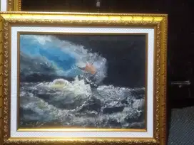 Perahu  diterjang kolombbang