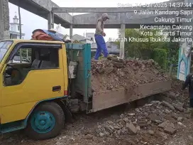 Urugan meterial puing,tanah merah dan buang sampah