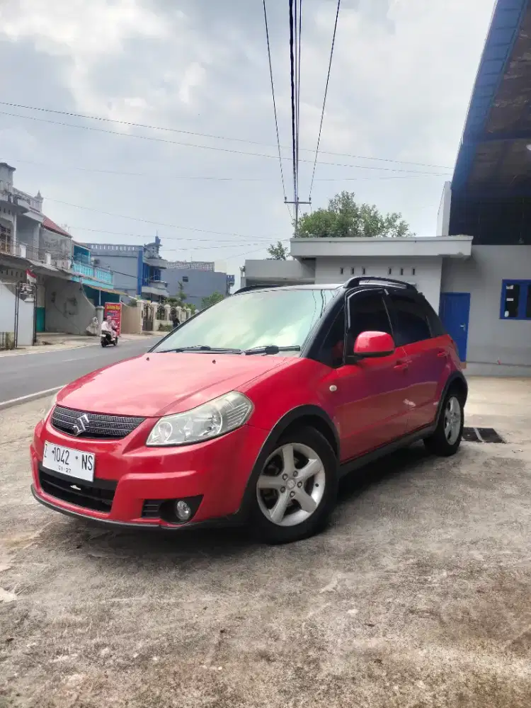 X over SX4 tahun 2008 Manual
