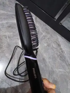 Sisir elektrik pelurus
