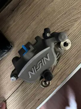 kaliper belakang xmax 250 nissin