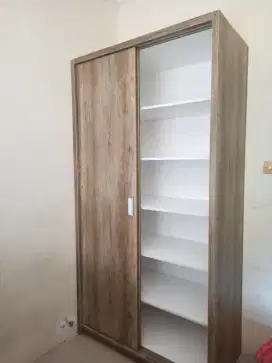 Lemari dua pintu sleding full isi rak ambalan