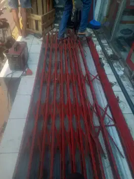 Tukang reparasi service rolling door folding gate murah