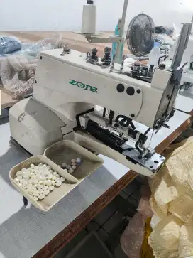 Mesin pasang kancing merk zoje dan stao