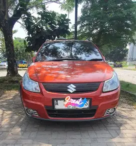 DIJUAL MURAH MOBIL SUZUKI SX4 2008 M/T WARNA ORANYE/OREN.