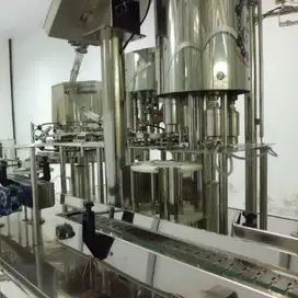 Mesin filling botol rotary