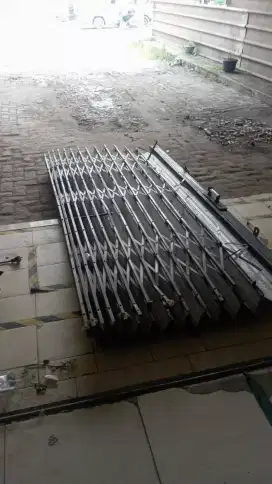 Spesialis service rolling door bergaransi